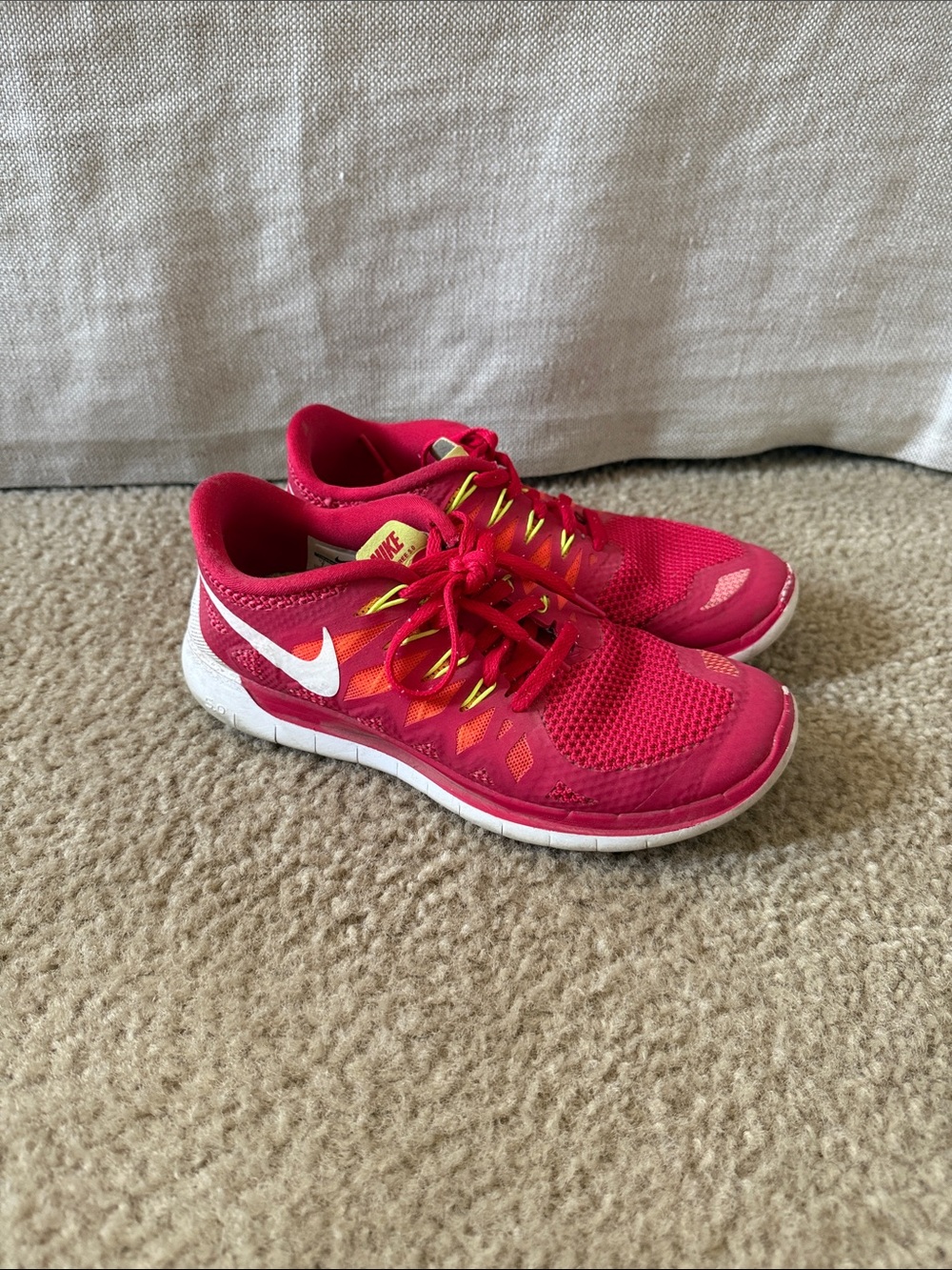Nike Red Athletic Sneakers with White Swoosh and Yellow Accents